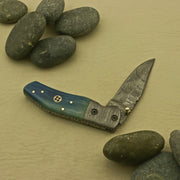 Handcrafted Foldable Pocket Knife with Custom Damascus Blade and Intricate Handle Design - An Exceptional and Personalized Present for Men, Made in the USA. Knives Terror Defender 